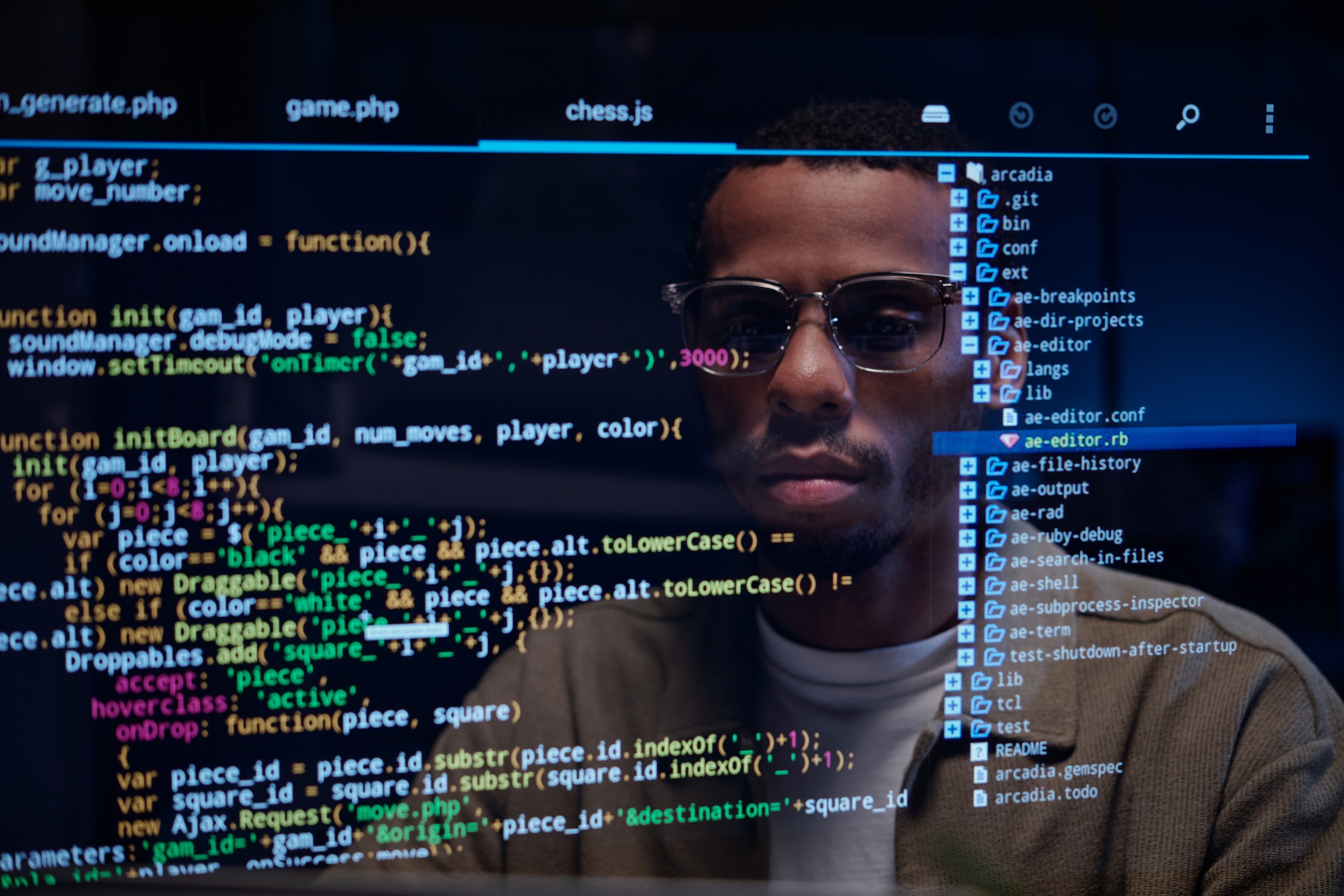 Developer Debugging Code in Dark Office Environment